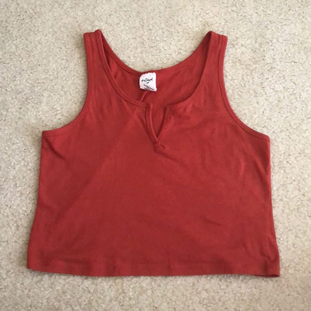 A Tilly’s red-ish Orange colored tank top